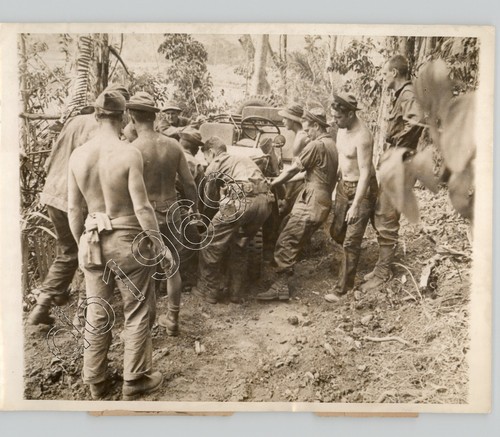 Soldiers pulling army jeep - us,