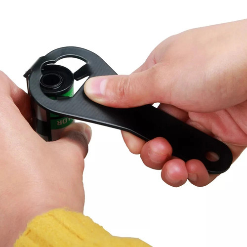 Film cartridge opener per - film,