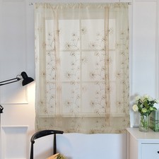 Tende ricamate riduttrici luce