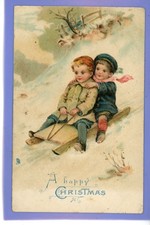 OLD VINTAGE 1906 EMBOSSED TUCK CHRISTMAS POSTCARD TWO BOYS ON SLEDGE SNOW XMAS