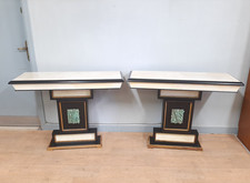 Coppia di consolle art deco in legno nero e pergamena con decori a bassorilievo