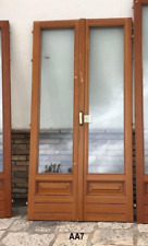 porte Finestre per balcone in legno massello a due ante con vetri