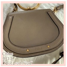 Borsa a tracolla con bracciale