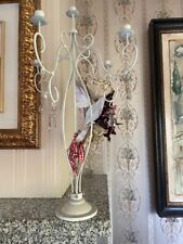 Candelabro in ferro con 4 bracci retrattiblii e altre decorazioni.