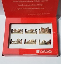 Sorpresine tipo kinder metal diorama serie 6 segnaposti LOREAL