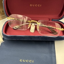Gucci GG1221O 002 oro con aste