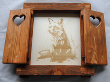 Finestra in legno con scuri