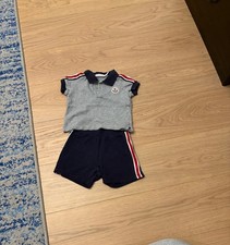 Polo Moncler in piqué e set