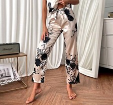 Pantaloni lunghi in raso bianchi e neri