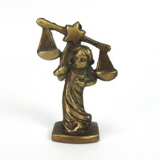 Statua in ottone segno