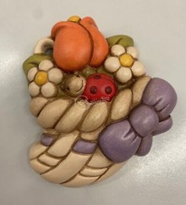 Cornucopia fiori e coccinella