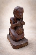 Scultura in legno intagliato-