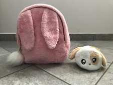 Zaino peluche rosa e portaoggetti a forma di coniglio. Dimensioni 31x27x12 cm