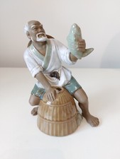 Statuina pescatore fango