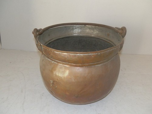 Antique copper pot with iron - with,