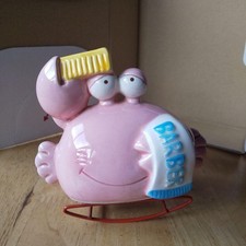 Salvadanaio granchio altalena