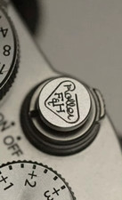 Pulsante otturatore a rilascio