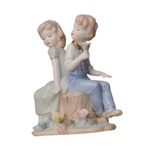 Boy and girl statue - and,