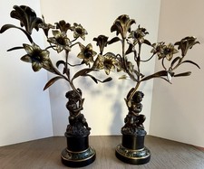 Coppia di candelabri putti