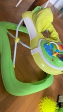 girello per bambini cam verde con giochi. Come nuovo.