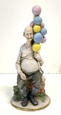 Statuina porcellana vintage Pucci Capodimonte vecchio venditore palloncini Italia