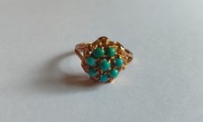 Anello oro k 18 con incastonati a fiore turchesi persiani