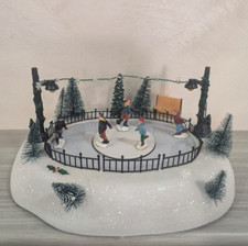 NATALE GIOSTRINA Pista Pattinaggio Carillon Led Movimento con Luci Villaggio