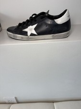 Oca dorata nera con stella