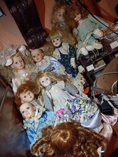 Lotto 8 bambole di porcellana