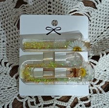 MOLLETTE PER CAPELLI IN RESINA CON MARGHERITA. 