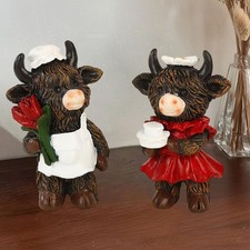 1 paio di statuette di mucche
