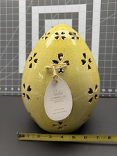 Uovo giallo in ceramica da