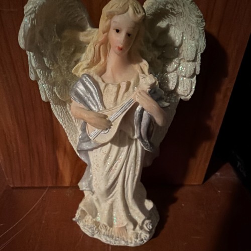 Statuina angelo con - , strumento