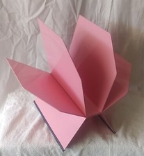 portariviste in metallo laccato rosa sintesi