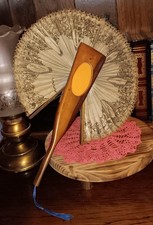 Antico torciera da coccarda