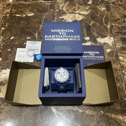 Swatch omega mission - x, to