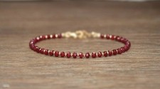 Bracciale perle rubino 18