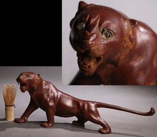 Vecchia statua tigre ruggente