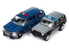 CHEVROLET Tahoe 1997 + Jeep Cherokee XJ - Polizia - Johnny Lightning 1:64