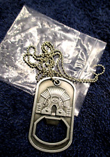 NUOVO OAKLEY DOG TAG APRIBOTTIGLIE TAPPO PORTACHIAVI CORDINO DISPLAY UNA CATENA ICONA