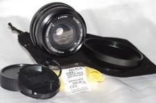 Objectif Minolta MD 28mm f2,8 VIVITAR avec bouchons, pare-soleil et housse TBE