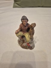 presepe  marca ? uomo seduto