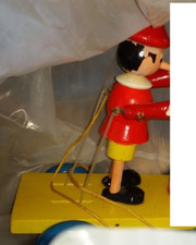Wooden pinocchio with wheels