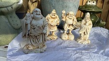 Quattro figurine dio asiatico