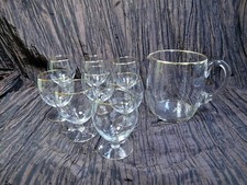 Servizio caraffa e 8 bicchieri a calice in cristallo Italia anni 50, non usati.