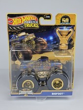 Hot Wheels Monster Truck Mattel - 50 Bigfoot 2025 1/64 Trofeo Campione Oro
