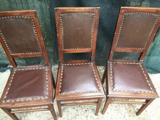 Set di 6 sedie di fine '800 con legno intarsiato e seduta in pelle borchiata