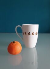 "LINDT" Tazza alta, disegno "Gold Bunny", porcellana bianca, altezza 11,5 cm.