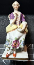 An Early To Mid 20th Century Capodimonte Minature Seated Lady