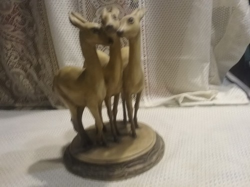 Tre cerbiatti scultura - tre,